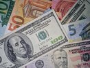 Курс доллара поднялся до 107 рублей и почти сравнялся с евро